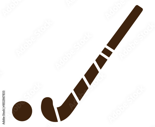 A hockey stick is positioned next to a hockey ball on a white background.