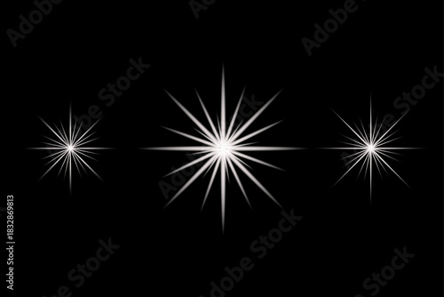 Three distinct sparkling starbursts with sharp points radiate bright white light against a deep black background