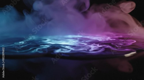 Vibrant blue, purple, and pink smoke reflecting on a dark surface