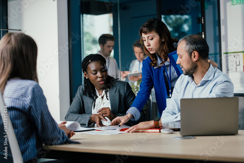 Black Female Manager Leading Feedback Session as Student Intern Joins Team