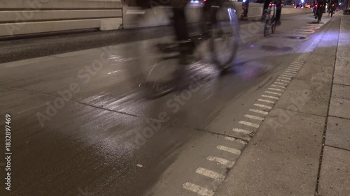 Stockholm, Sweden Bicycles on a rainy bike path at night.