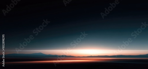 Sunset over mountains with calm water