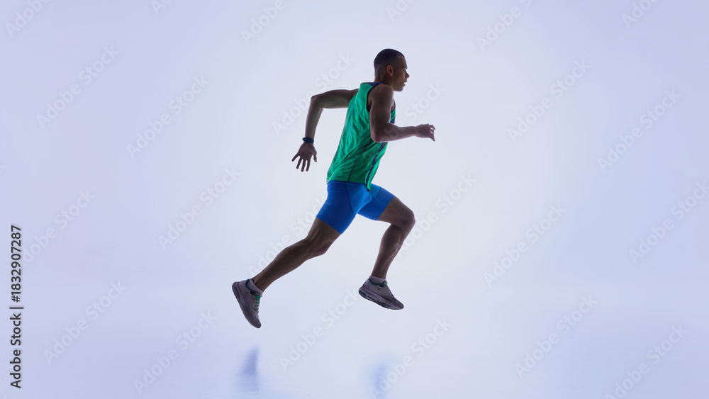 Naklejka premium Runner in suspended forward motion during active sprint. Concept of sports promo materials, biomechanics explainer visuals, athletic progress tracking, and workout program design.