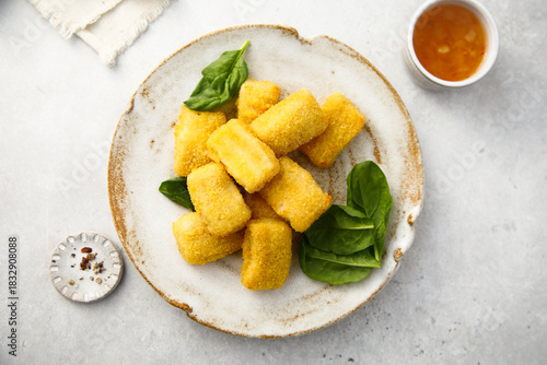 Fish nuggets with fresh spinach