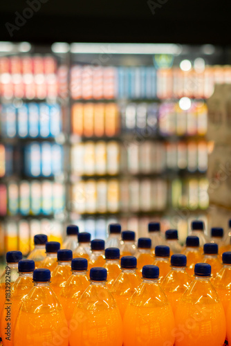 Rows of Refreshing Orange Beverages in a Store