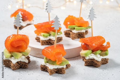 Colorful appetizer bites with smoked salmon and avocado for a festive occasion