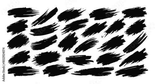 Collection of black ink brush strokes and paint splashes on a white background art design
