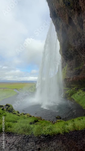 Epic Backside View of Seljalandsfoss Waterfall and Mossy Rocks