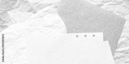 Dirty dusty background with soft grain noise and folds of crumpled grid paper. Gritty dotted halftone texture, retro grunge notebook page.
