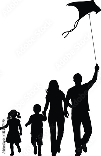 Happy family of four silhouette flying a kite Parents and two children enjoying outdoor leisure activity together