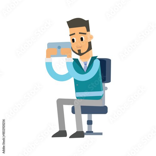 Man sitting on an office chair focused on working or playing on a tablet