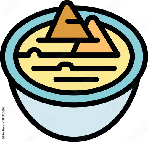 Creamy hummus decorated with pita triangles resembling pyramids evokes the flavors and culture of the middle east