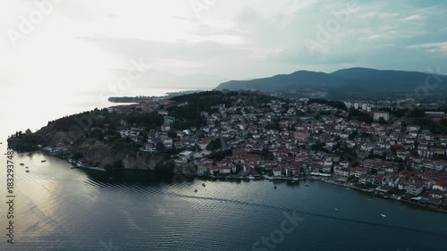 High angle footage of Ohrid with lots of boats near the shore, North Macedonia