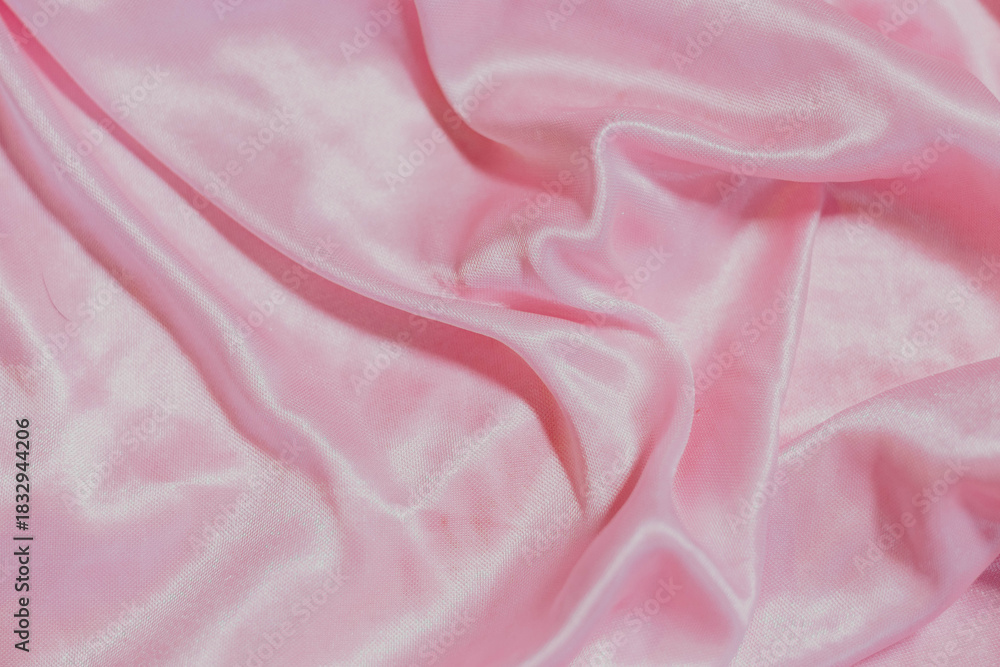 Obraz premium pink silk fabric background with folds