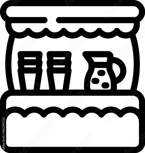 Street food stall with disposable cups and a pitcher full of refreshing juice, perfect for a quick snack or beverage