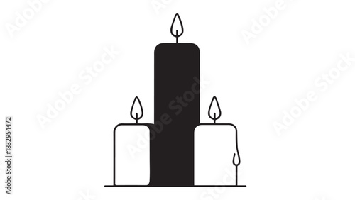 Three candle centerpiece featuring a tall black candle flanked by two white candles in a minimalist still life arrangement.