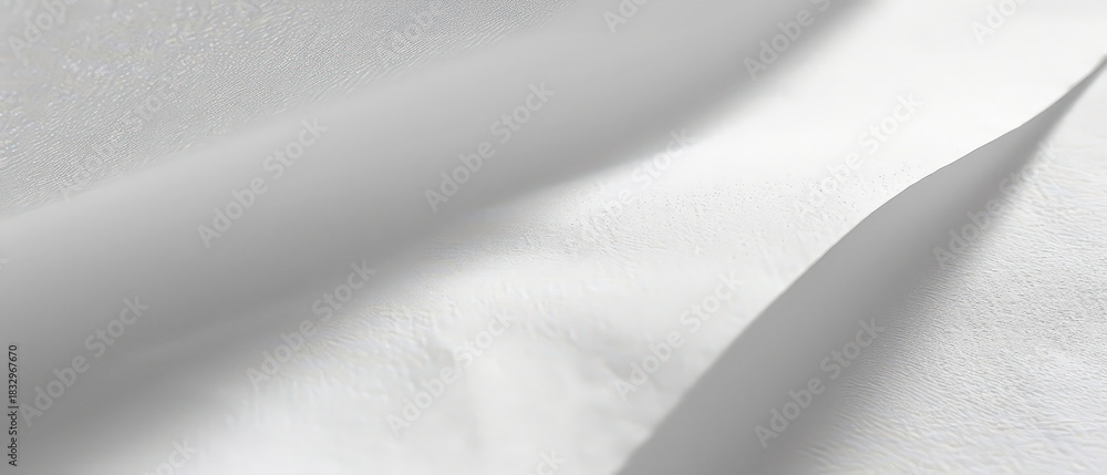 Fototapeta premium Close-up of clean white paper showing subtle texture and gentle creases. Ideal for minimal backgrounds or mockups