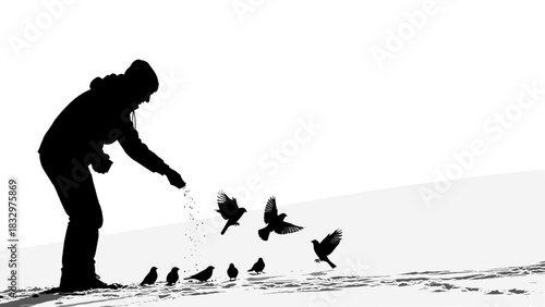 Silhouette of person feeding birds in winter landscape  