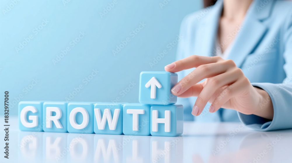 Obraz premium Business growth concept with blue wooden blocks, professional woman hand stacking cubes with arrow icon, financial success and corporate development strategy theme