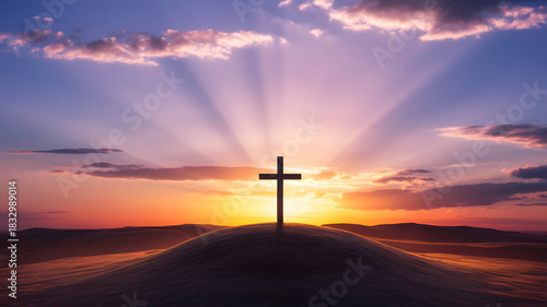 Silhouette of a christian cross against a dramatic sunrise sky
