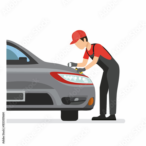 Mechanic in red uniform inspecting car headlight in garage with focused expression, ensuring proper functionality and safety.