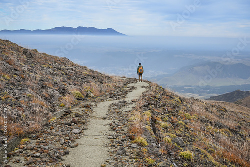 Landscape View Of Aso City And Mountains With Silvergrass On The Trail To Peak Nakadake, Aso Kuju National Park, Kumamoto, Kyushu, Japan