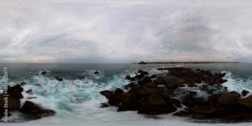 Top view of Waves crashing on a rocky island. Ahangama beach. 360 panorama VR.