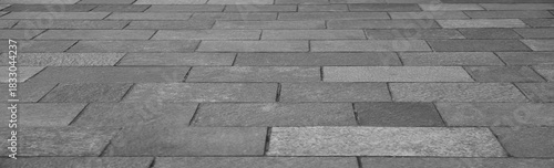 brown  gray patterned sidewalk tiles. surface  with geometric texture . grey tiled patio floor Perspective  background