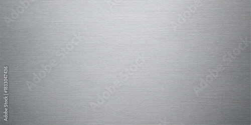 Brushed metallic texture of a stainless steel plate's surface creates a rugged industrial pattern