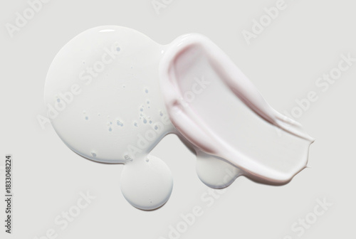 Cosmetic beauty product texture sample swatch. Two products mix set. Translucent gel serum or peeling and milky pink cream balm isolated on neutral grey