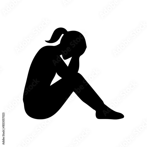 Woman silhouette crouching in despair feeling depressed