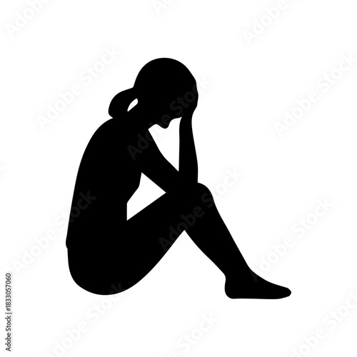 Woman silhouette crouching in despair feeling depressed