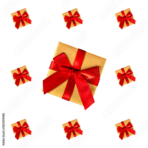 Top view of gift boxes wrapped in craft paper and red ribbon bow isolated on white.