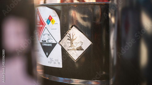 Environmental impact hazard placard sign on the chemical barrel. The chemical will create biological pollution if it leaking to the environment.