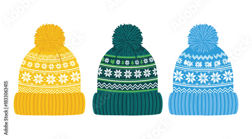 Three knitted winter hats with pom poms and snowflake patterns in yellow teal and blue