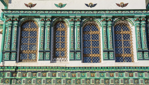 The wall of the ancient temple is decorated with tiled tiles