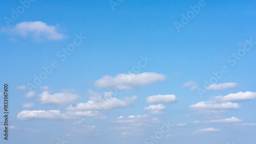 Fotografija Blue sky with a few scattered white clouds