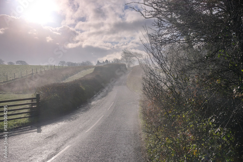 Beautiful sunny and cold December morning in the south west, UK. Low lying mist being slowly burnt back by bright autumn, winter sunshine