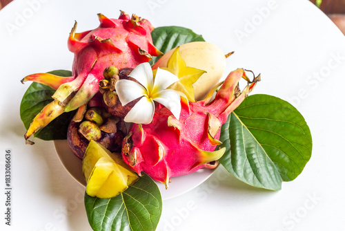 Wallpaper Mural Different tropical fruits set. Healthy vegetarian food. Pitaya fruit, lychee, mangosteen, mango on white table. Torontodigital.ca