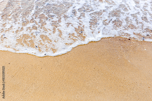 Fototapeta Naklejka Na Ścianę i Meble -  Sand beach with sea waves at coast. Copy space