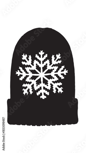 Warm knit beanie with white snowflake pattern on black fabric for winter wear.