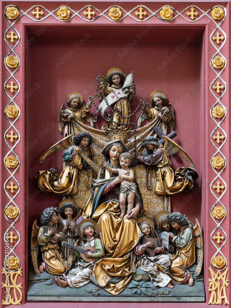 Fototapeta premium Salzburg - The carved polychrome new gothic relief of Madonna among the Angels with the music instruments in the church Andrea kirche by unknown artist of 19. cent..