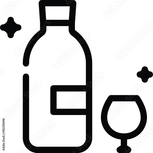 A sparkling liquor bottle and glass