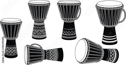 Collection of black and white djembe drums in various positions percussion musical instrument