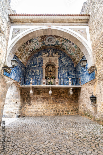 Porta da Vila is the main entrance to Obidos, Portugal. Double door with balcony. Inside azulejos