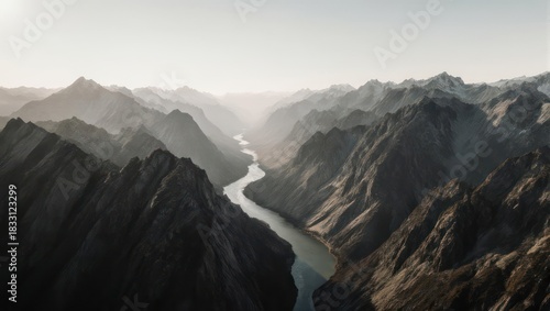 Majestic River Carving Through Rugged Mountain Range at Sunrise.
