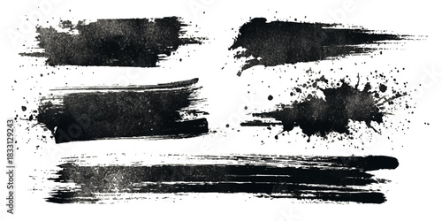 Collection of abstract black ink brush strokes and splatters on a textured light background
