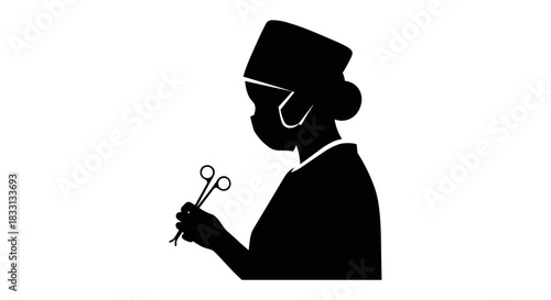 Silhouette of a Surgeon Holding Surgical Instruments in Operating Room.