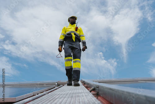 Technicians are installing outdoor solar panel systems. Solar rooftop installation. Solar panels on the roof. Workers are installing energy-saving solar power generation systems.