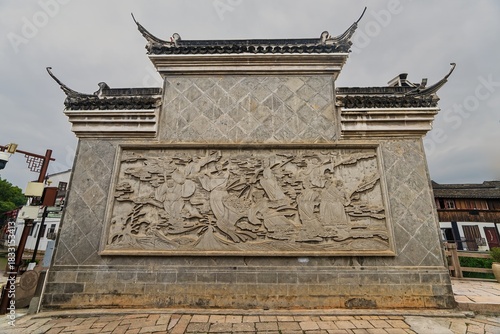 Canvas Print Asia, China, Shanghai, Zhujiajiao, 09 November 2025, old stone wall with carving
